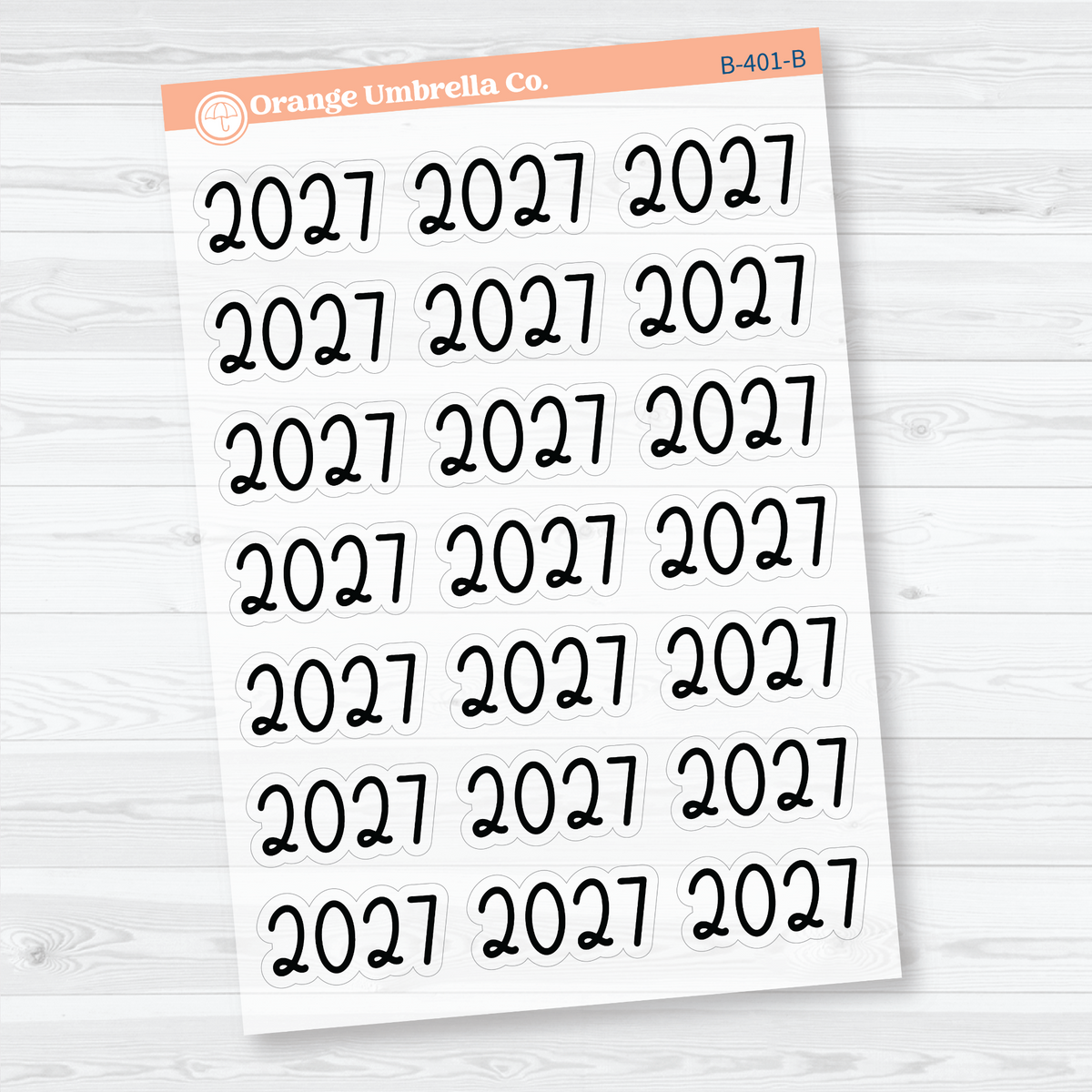Sheet of 21 large black 2027 year label stickers on transparent clear matte paper for planners and journals.