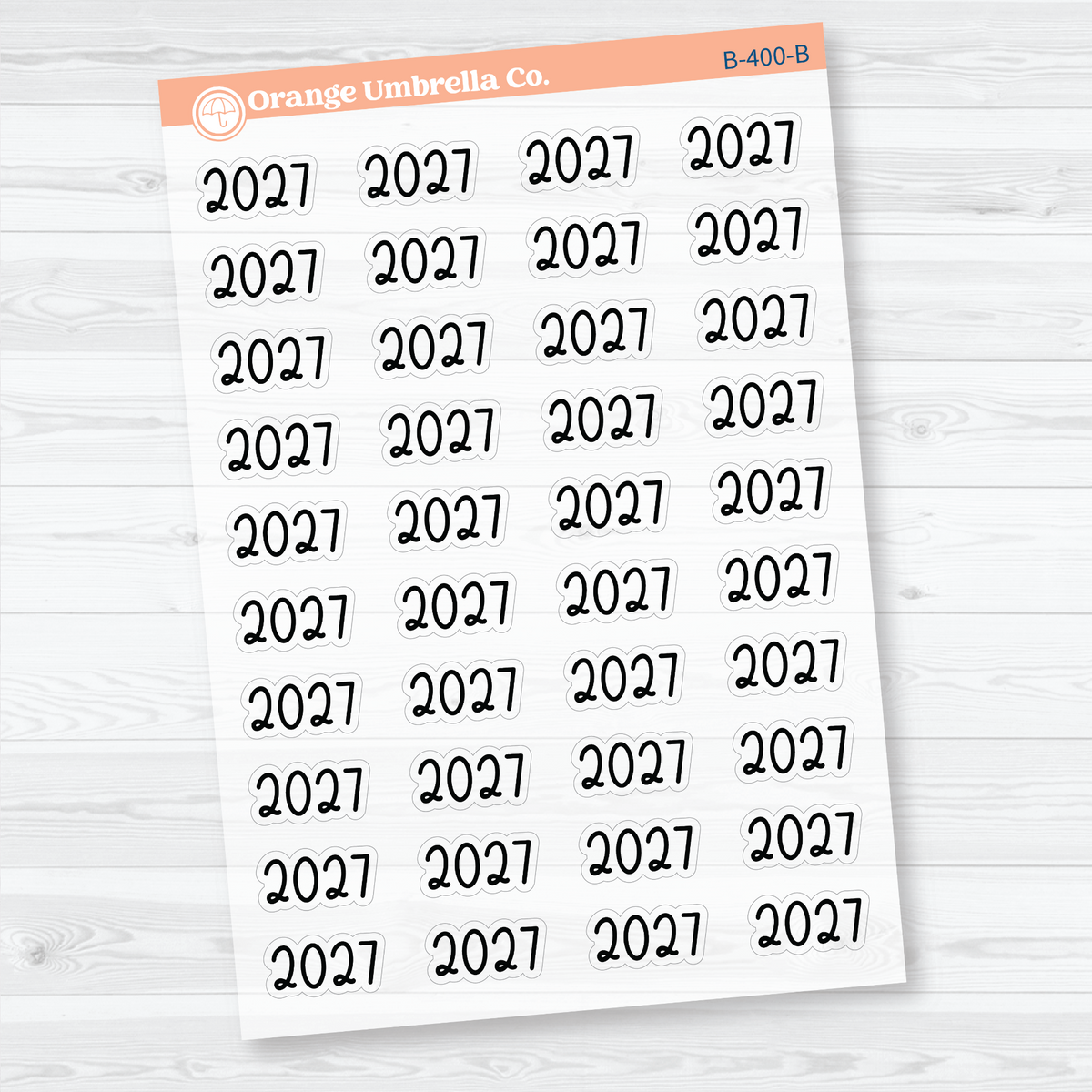 Sheet of 40 medium black 2027 year label stickers on transparent clear matte paper for planners and journals.
