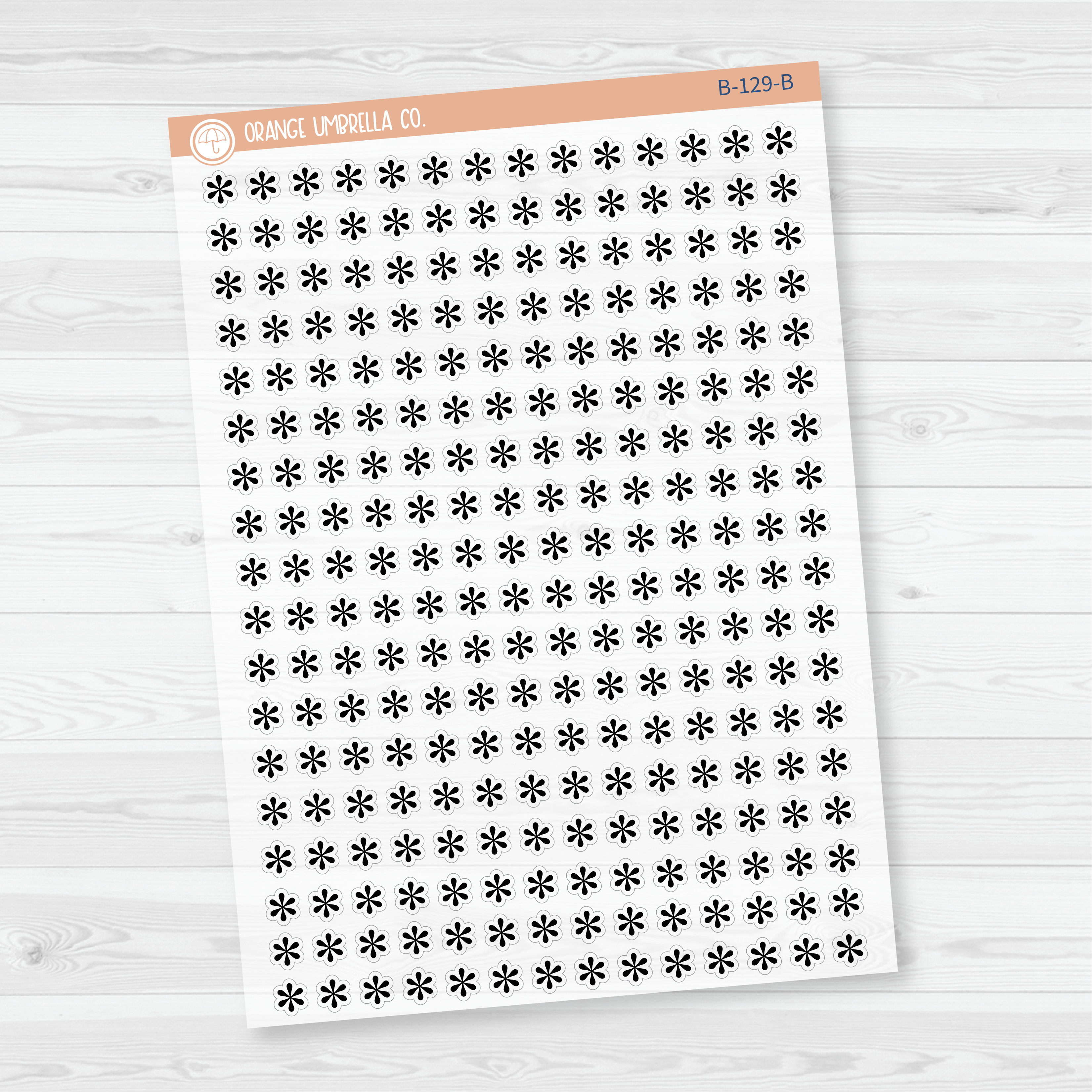 Sheet of asterisk icon planner stickers in Black, styled flat lay