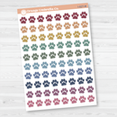 Sheet of colorful paw print stickers by Orange Umbrella Co. on a white background