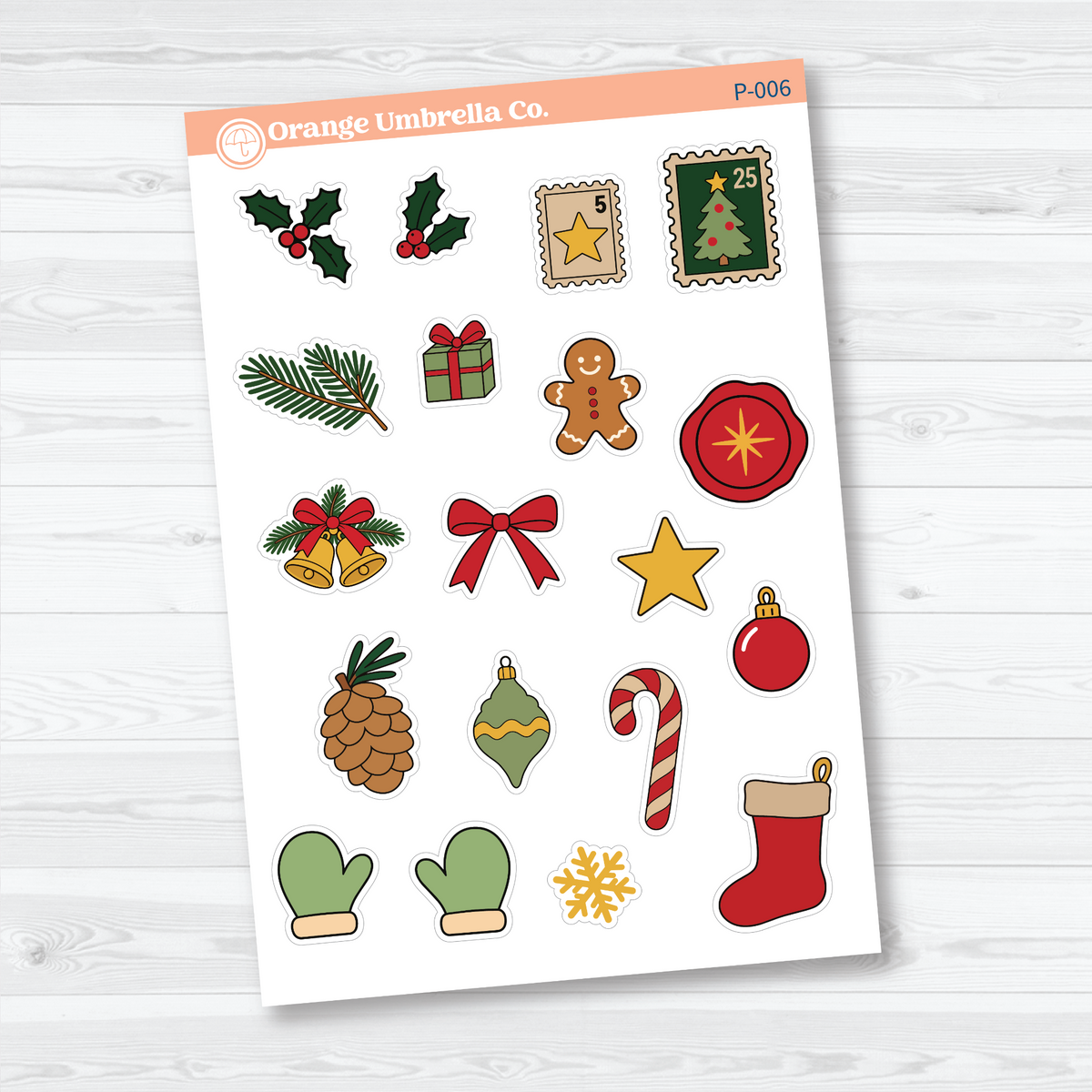 White matte Christmas doodle stickers with holly, stamps, gingerbread, ornaments, a candy cane, mittens, and a stocking for holiday journal pages.