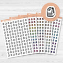 White matte sticker sheet with small black and white backpack icons for school and planner use.