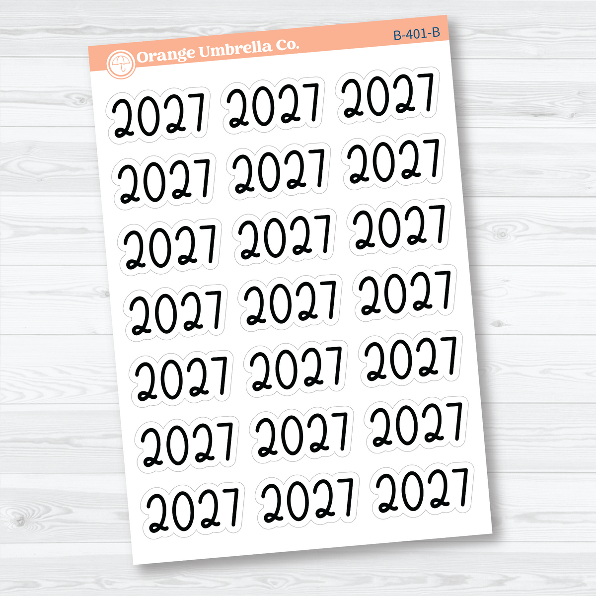 Sheet of 21 large black 2027 year label stickers on white matte paper for planners and journals.