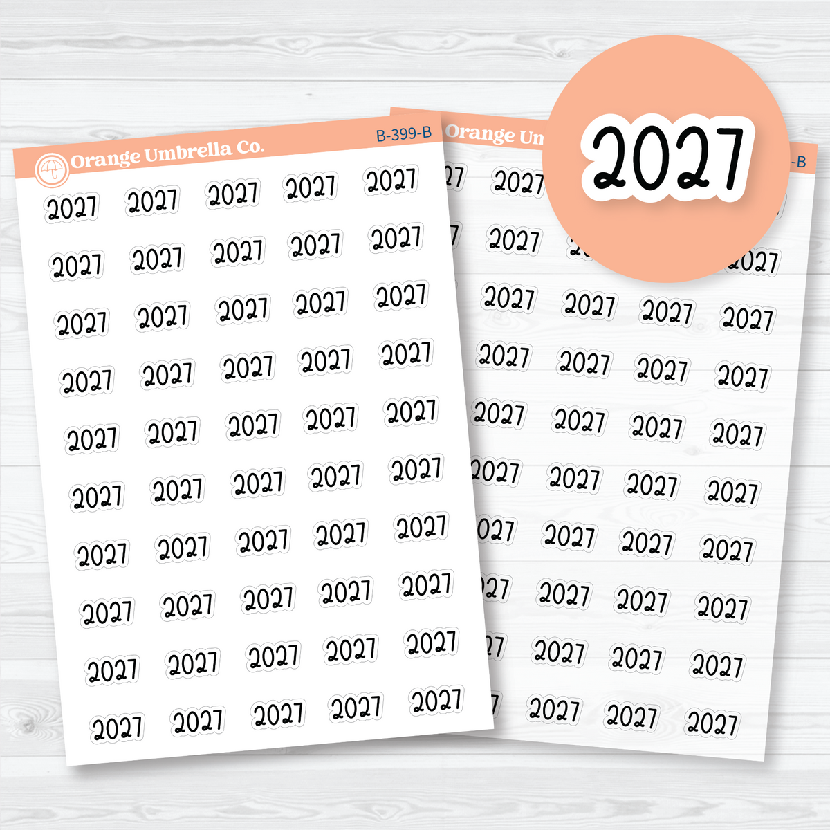 Mini black 2027 year label stickers in rounded Font 18 lettering, shown on white matte and clear matte sheets for planner and journal headings.