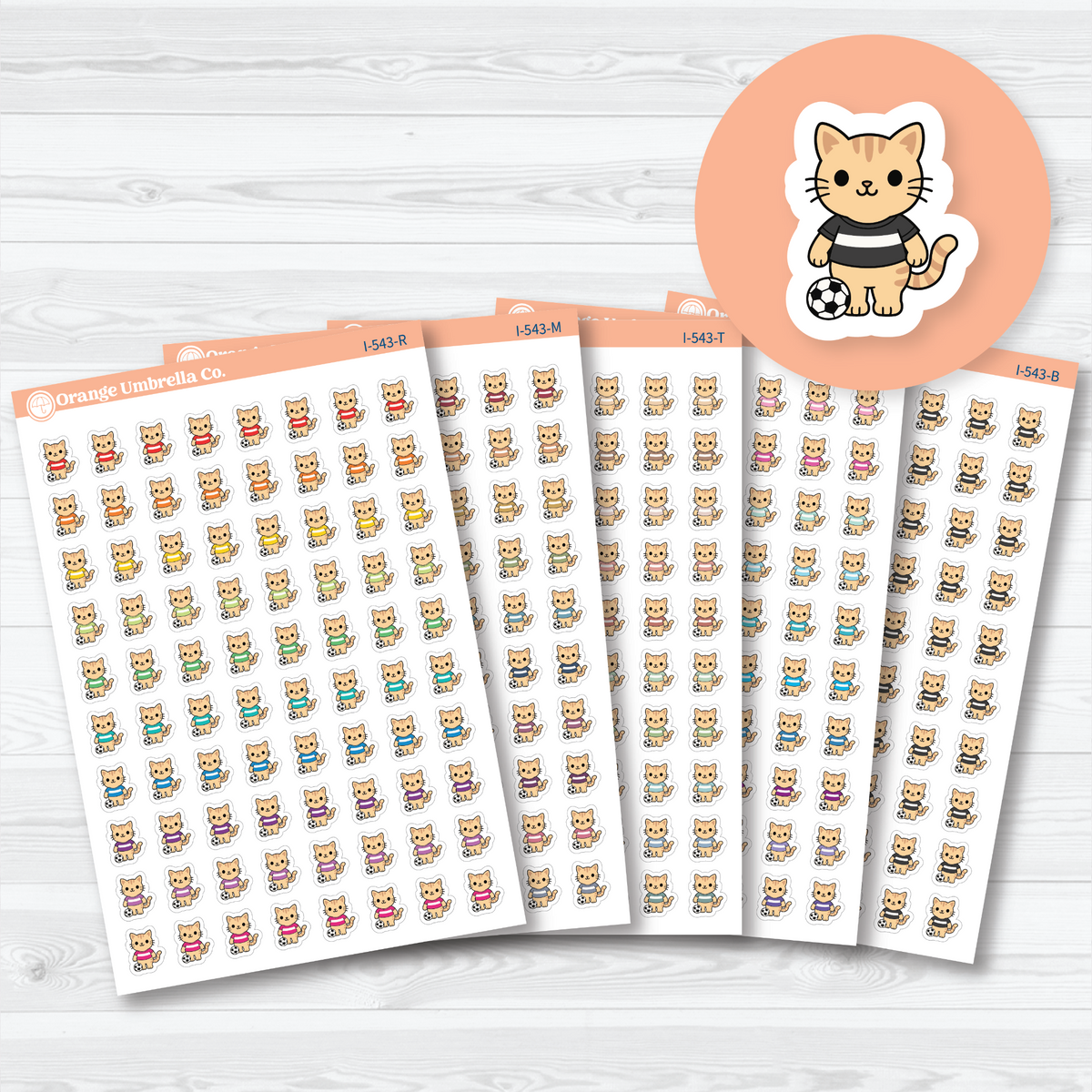 Mini soccer Spazz white matte sticker sheets showing an orange cat beside a soccer ball, with five color choices for sports planning.