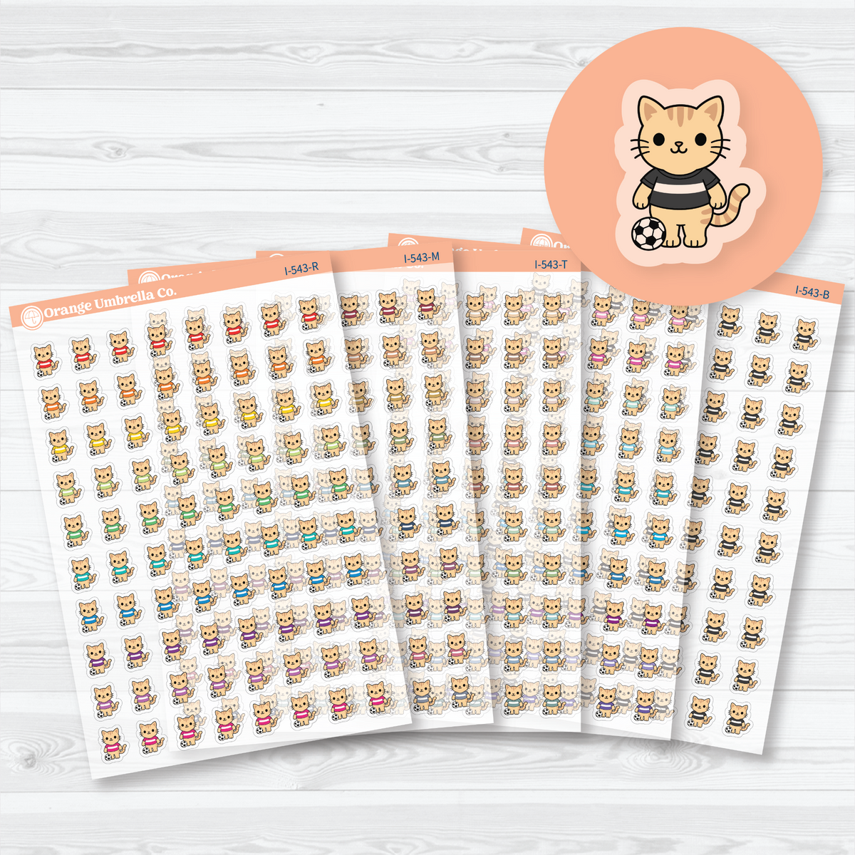 Mini soccer Spazz clear matte sticker sheets showing an orange cat beside a soccer ball, with five color choices for sports planning.